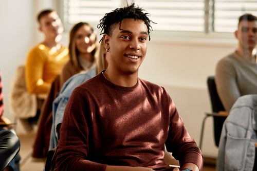Young man sitting in classroom